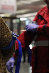 Demonstration of how to properly put a tourniquet on the arm. First aid training
