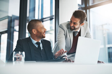 Businessmen, laptop and smile for support in office, accounting agency and teamwork for project. Collaboration, discussion and mentorship with internship, planning and problem solving for finance