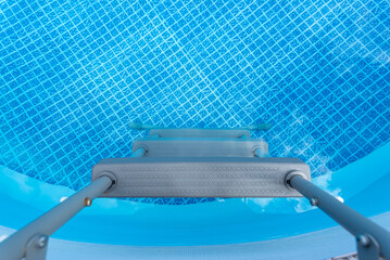 Large expansion pool with a diameter of 3.96 meters, placed in the yard on the grass.