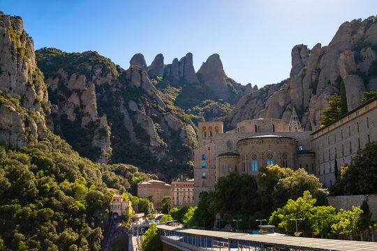 Detailed view of Montserrat mountain in Catalonia with its characteristic towering peaks above the monastery on a sunny spring afternoon