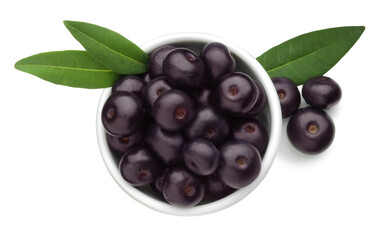 Fresh ripe acai berries in bowl and green leaves isolated on white, top view