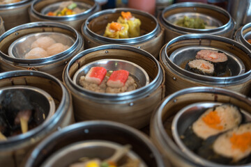 Arrangement of various dim sum in bamboo steamer. Close up