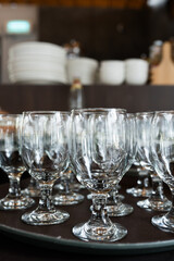 Close up on many empty glasses on table.