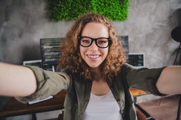 Photo of cheerful cute woman assistant secretary recording video modern workspace workstation...