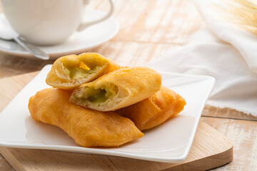 Pandan custard with fried stick bread,Thai style Chinese Doughnut stuffed with smooth creamy pandan kaya