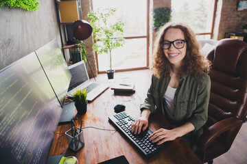 Photo of lovely adorable successful woman coder hacker sitting armchair comfortable workspace...