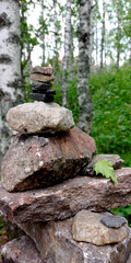 Photos of nature, mountains. Pyramid of stones stacked on top of each other. Tzen like high balanced stones pile. Taganai National Park, Russia.