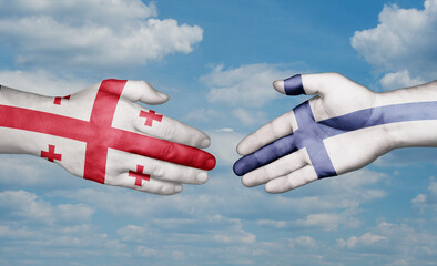Finland and Georgia country handshaking with flags, consensus concept international co-operation illustration