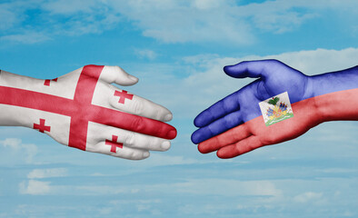 Haiti and Georgia country handshaking with flags, consensus concept international co-operation illustration