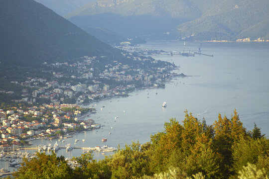Aerial view of the coast of the municipality of Herceg Novi: the coastline with the villages of Bilela, Bosici and Djenovici against the backdrop of majestic mountains. Bay of Kotor, Montenegro.