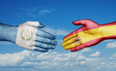 Spain and Guatemala country handshaking with flags, consensus concept international co-operation illustration