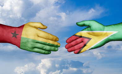 Guinea-Bissau and Guyana country handshaking with flags, consensus concept international co-operation illustration