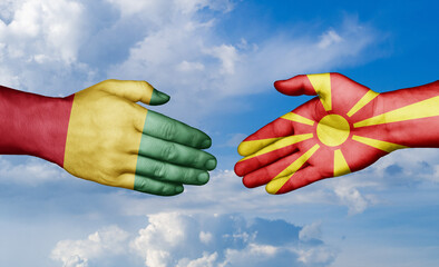 North Macedonia and  Guinea-Conakry country handshaking with flags, consensus concept international co-operation illustration