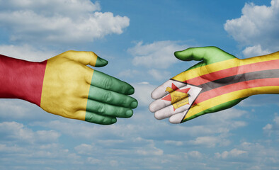 Zimbabwe and  Guinea-Conakry country handshaking with flags, consensus concept international co-operation illustration