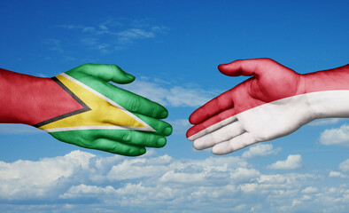 Indonesia and Guyana country handshaking with flags, consensus concept international co-operation illustration