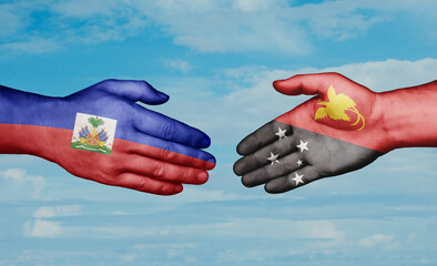 Papua New Guinea and Haiti country handshaking with flags, consensus concept international co-operation illustration