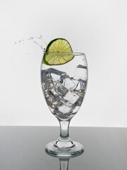 Dropping a lime into water.