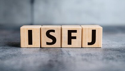 Wooden cubes with text ISFJ. Introversion, Sensing, Feeling, Judging. Personality type. Close-up.