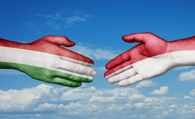 Indonesia and Hungary country handshaking with flags, consensus concept international co-operation illustration