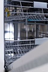 Crop of drawer in empty dishwasher