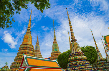 Fototapeta premium Picture of pagodas in Wat Pho in Bangkok, Thailand, one of Thailand's oldest temples.