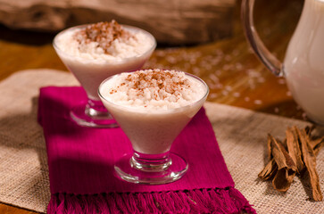 2 Cups of sweet rice pudding on a hand-made individual tablecloth.