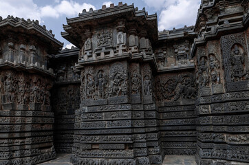 Intricate carvings of Hindu deities and also depict scenes from Hindu epics in the Hindu temple of Halebidu. India.