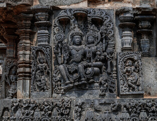 Intricate carvings of Hindu deities and also depict scenes from Hindu epics in the Hindu temple of Halebidu. India.