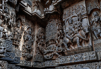 Intricate carvings of Hindu deities and also depict scenes from Hindu epics in the Hindu temple of Halebidu. India.
