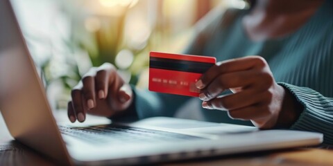 Hands working on laptop computer
