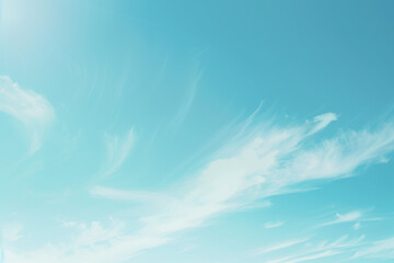 Bright summer sky with fluffy white clouds and sunlight