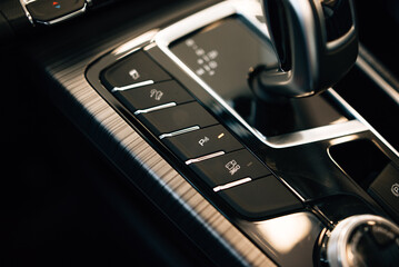 Automatic transmission gear with leather of luxury car. Black interior with chrome details