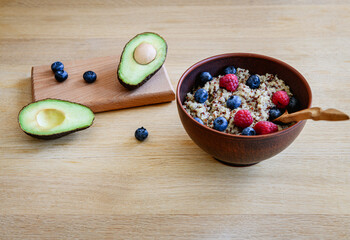 Bowl with quinoa and berries, healthy eating