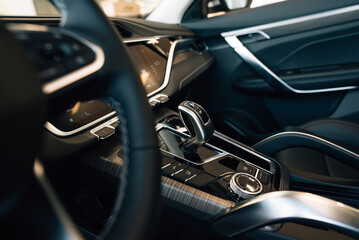 Automatic transmission gear with leather of luxury car. Black interior with chrome details