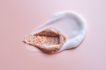 Cream and cream scrub on a pink background. Texture.