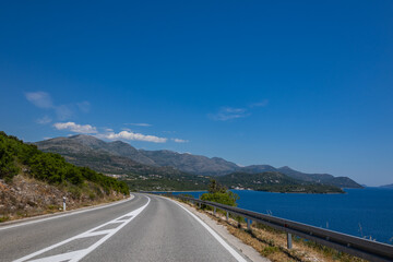 Croatia road. Croatia - Adriatic Highway (Jadranska Magistrala) road along the coast. Croatia. Beautiful nature and landscape. Coastal Road and Sea in Summer