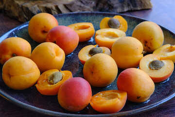 yellow ripe apricots on a plate