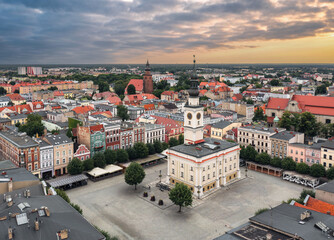 Aerial summer skyline cityscape of Leszno, Poland at sunset. Panoramic view of the old town market (Rynek) square and town hall (Ratusz)
