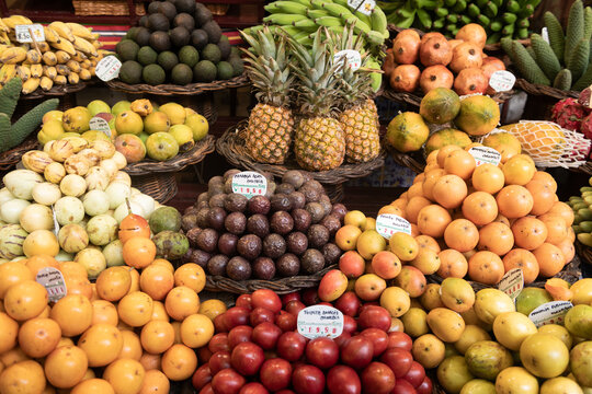 background of colorful piles of fruits and vegetables on Funchal market on Madeira, Portugal