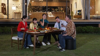 Family gather celebrate holiday. Parents, grandparents and girl together to talk and have dinner...