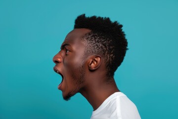 Obraz premium Energetic Man in Profile Silhouette with Matte Teal Background and Warm Light Glow