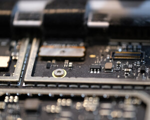 The inside of a laptop laid out on a surface still attached to computer shell