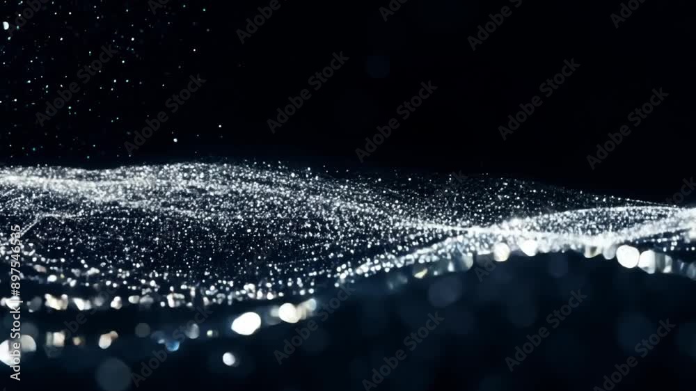 Aufkleber water droplets falling on a black background, creating a shimmering effect.