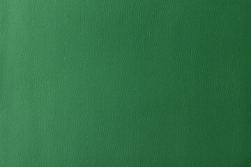 Texture of genuine leather, artificial leatherette green background