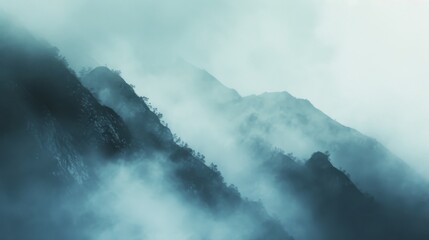 A serene landscape of mountains shrouded in mist and fog