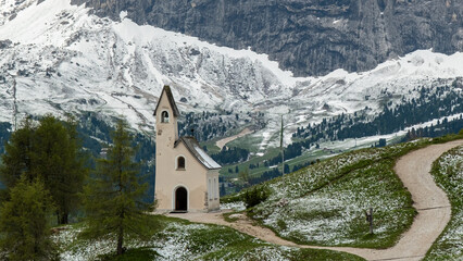 Solitary Church on a Mountain Path: A Serene Scene in the Dolomites