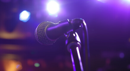 Obraz premium Microphone on stage with spotlights