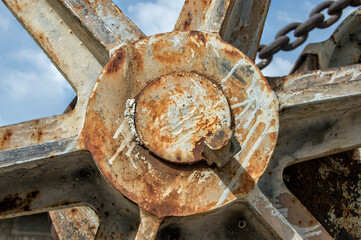 grey rusty metal piece close up view of a crane