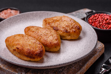 Delicious fresh fried minced fish cutlets with spices and herbs