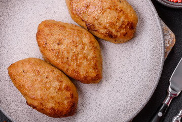 Delicious fresh fried minced fish cutlets with spices and herbs